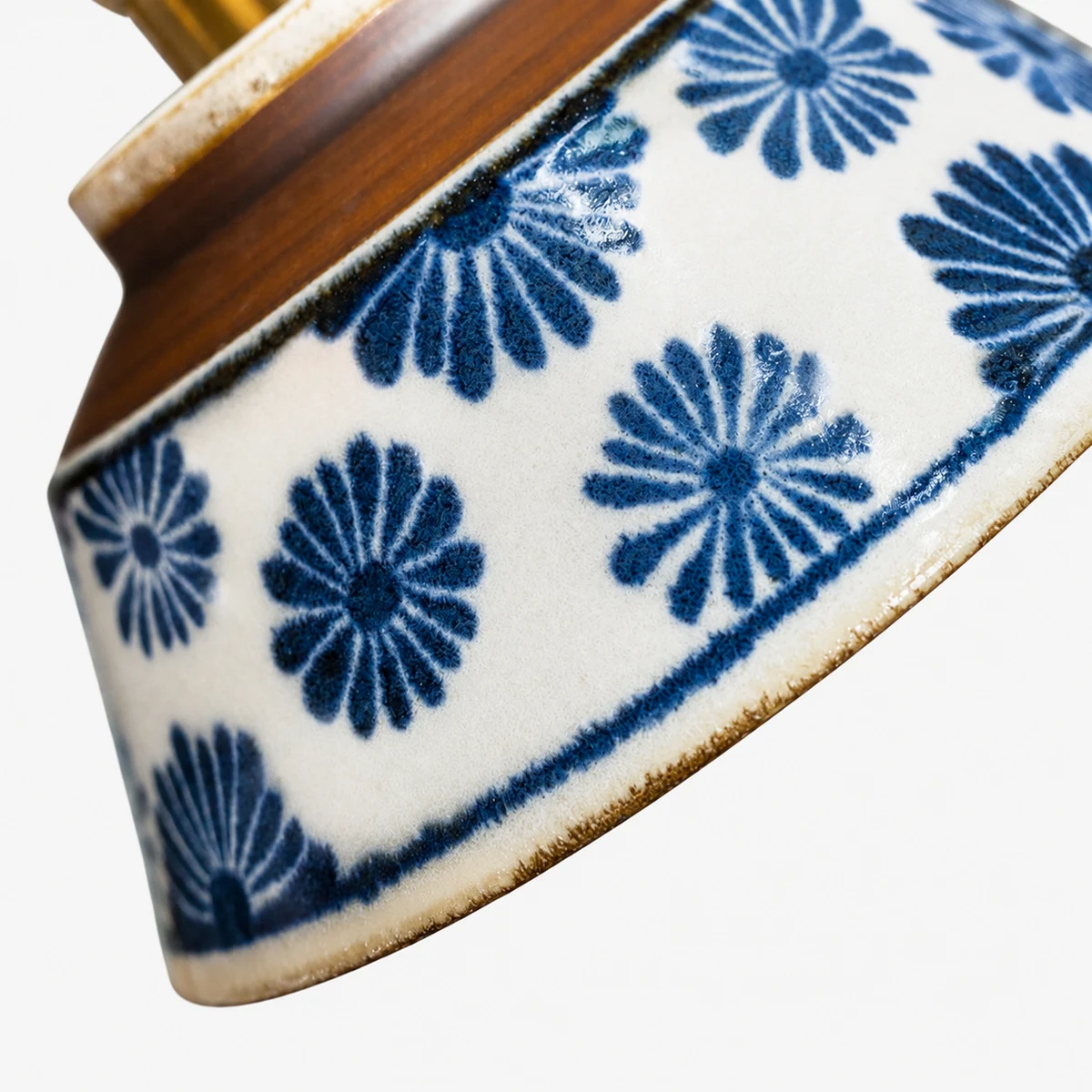 Close view of blue floral hand-painted ceramic pattern