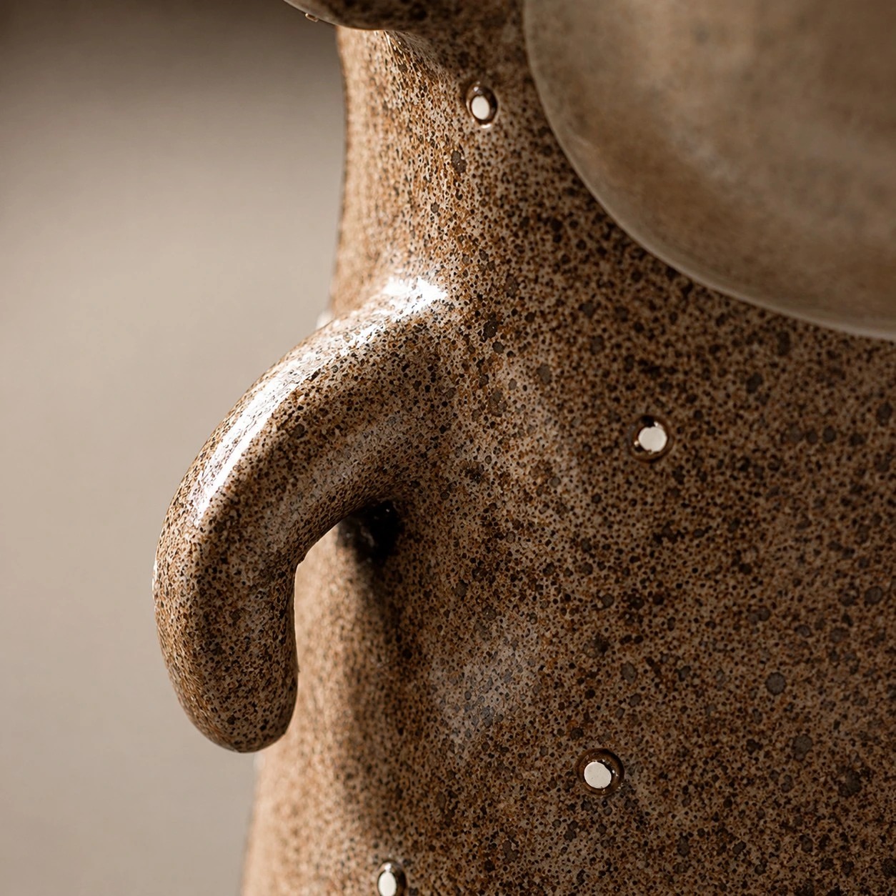 Close view of the monkey bookends textured resin surface