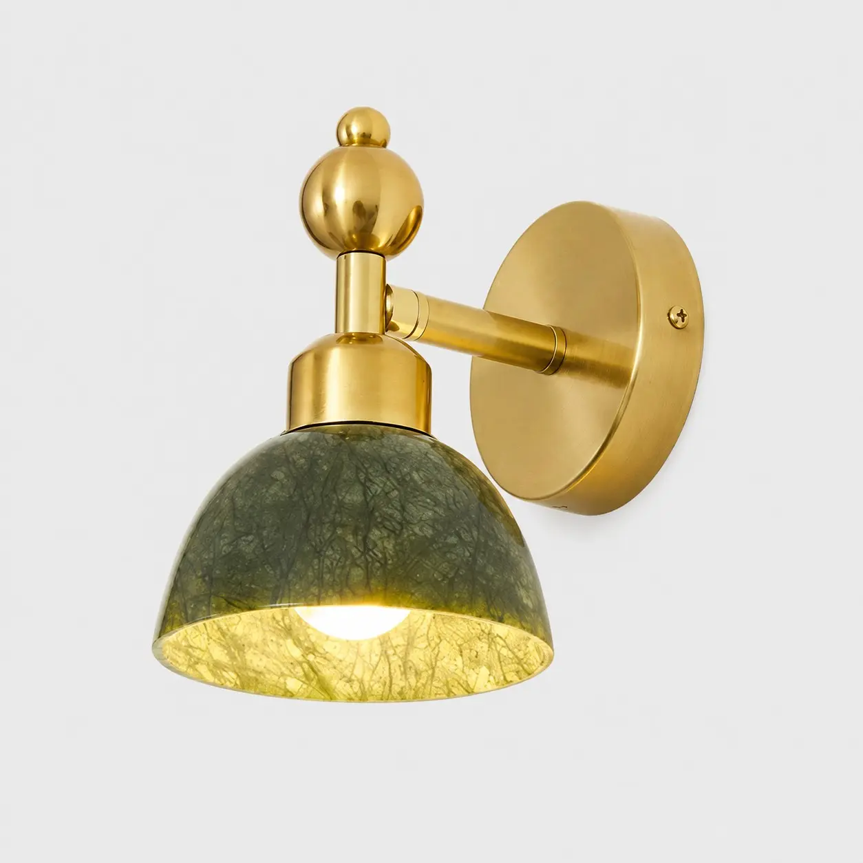 Green stone dome wall light with brass fitting